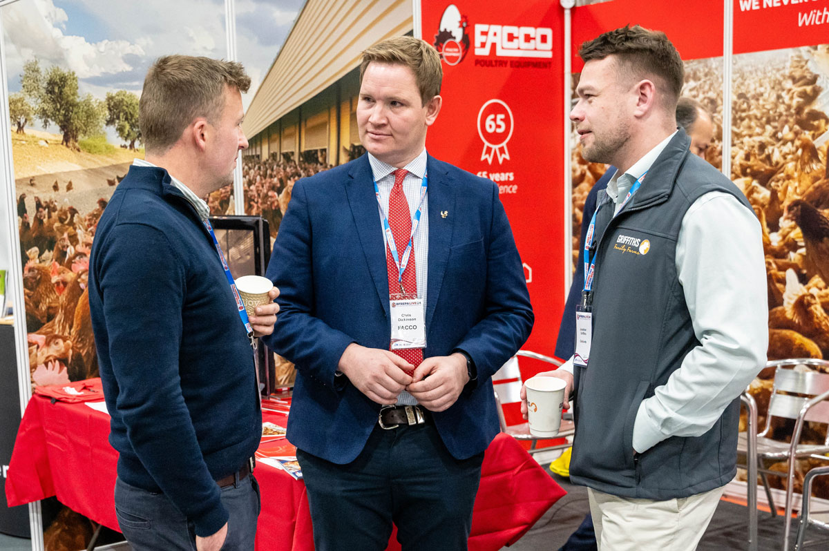 Producers and suppliers networking at a poultry trade stand